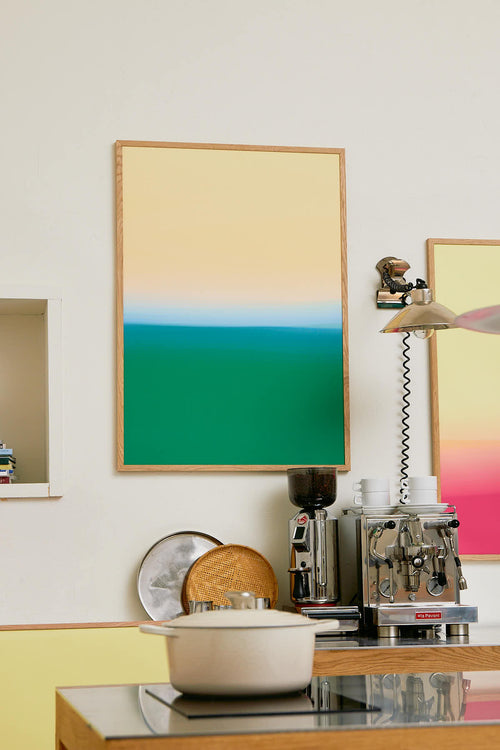 Colorful abstract art on a wall with kitchen appliances below