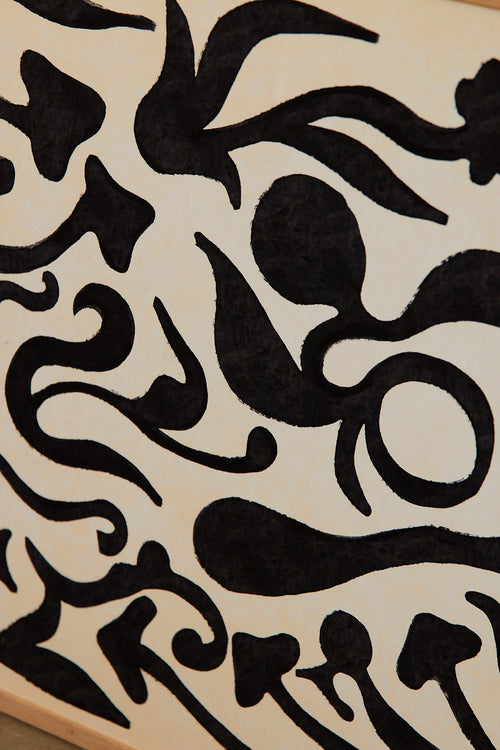 Art print with a minimalist illustration of black, organic, hand-drawn lines against an off-white background. Styled in a minimalist interior.