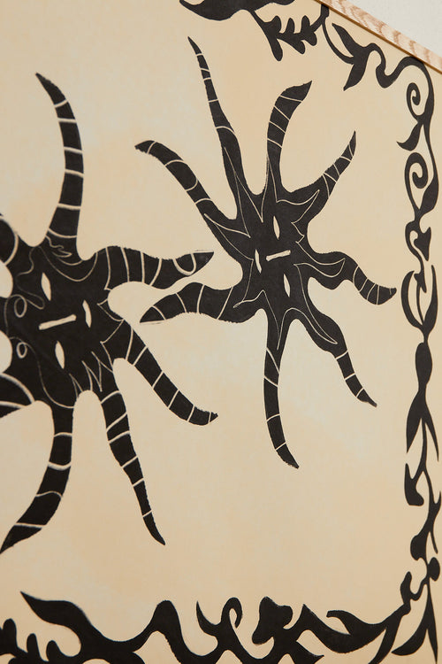 Art print with a minimalist illustration of black, organic, hand-drawn lines and suns against an off-white background. Styled in a minimalist interior.