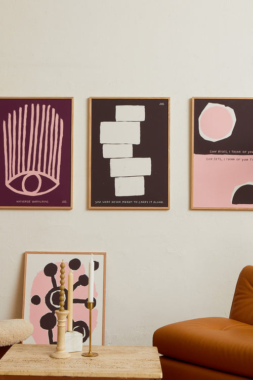 Art print featuring an abstract, minimalist painting in brown and white, and a handwritten note. Styled in a minimalist interior.