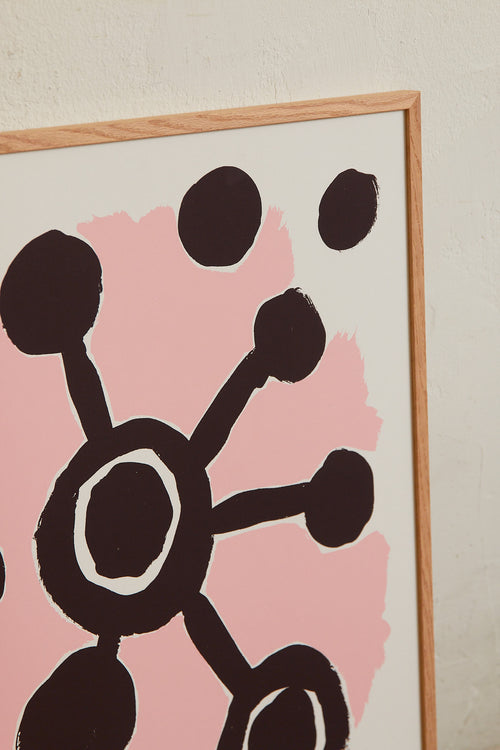 Art print with an abstract, minimalist painting in brown and pink referencing a distant universe, something that sometimes feels so close. Styled in a minimalist interior.