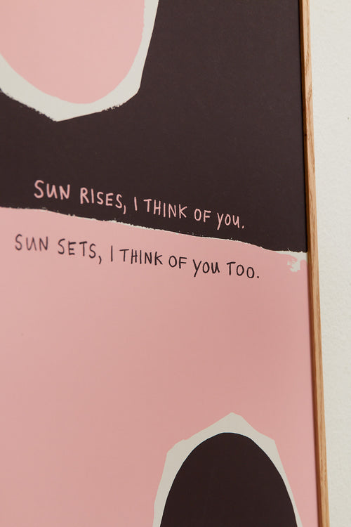 Art print with an abstract, minimalist painting in brown and pink that references a sunrise and a sunset. Styled in a minimalist interior.