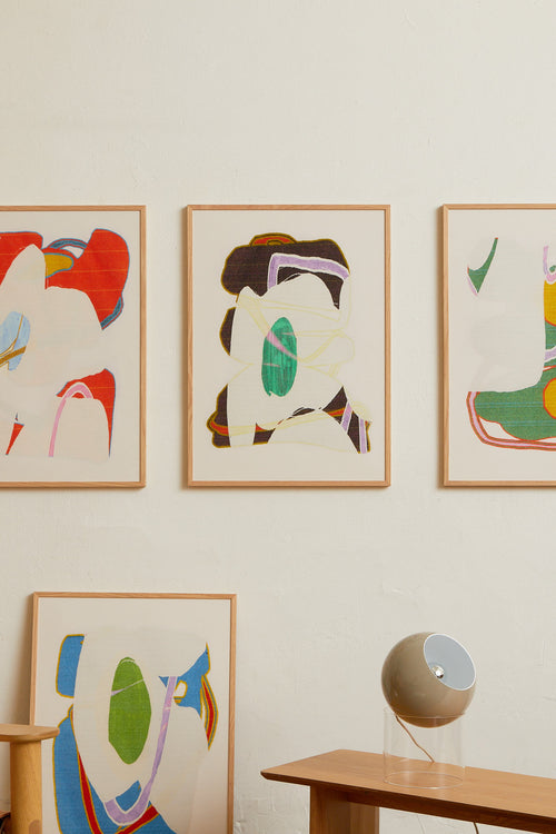 Art print with an abstract artwork featuring soft, overlapping shapes and a grainy texture. Earthy tones meet light fields and are framed by a distinct green core. Styled in a minimalist interior.