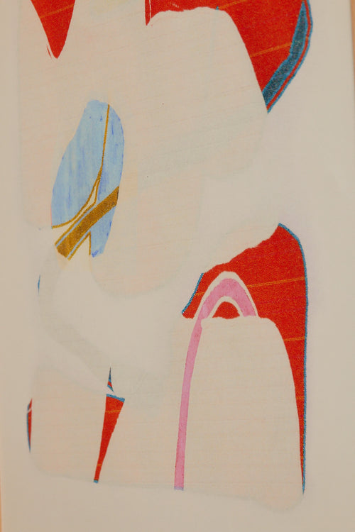 Art print with an abstract artwork featuring soft, overlapping shapes and a grainy texture. Bright red tones meet light fields and are framed by a distinct light blue core. Styled in a minimalist interior.