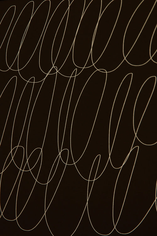 Art print with a graphic illustration of sweeping, continuous lines in a light tone against a dark green background, with a minimalist and abstract expression. Styled in a minimalist interior.