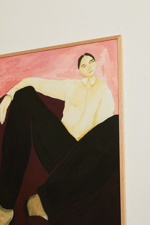 Art print featuring a painting of a person resting against a soft burgundy backdrop in front of a pink wall. The outfit is classic yet comfortable, with slippers and a shirt – business at the top, cozy on the feet. Styled in a minimalist interior.