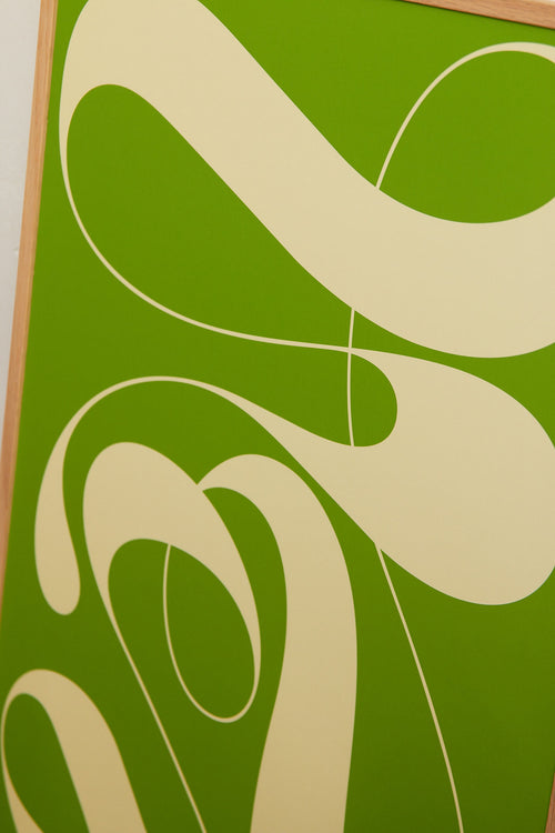Art print featuring exploratory organic forms emerging in two shades of green. Styled in a minimalist interior.