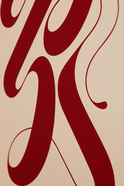 Art print featuring exploratory organic forms emerging in beige and red. Styled in a minimalist interior.