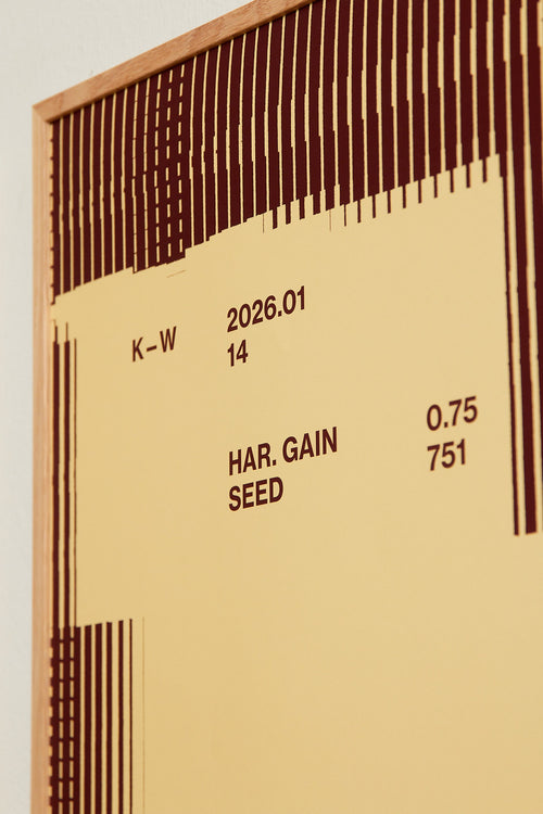 Art print with a graphic illustration of rectangular fields and linear patterns, combined with small text elements, in brown and beige RAL colors. Styled in a minimalist interior.