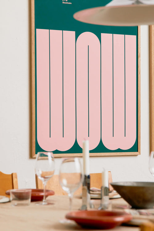 Dining room with a framed poster displaying the word 