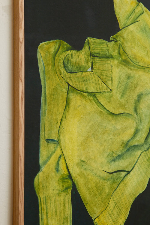 Green sweater on a black background