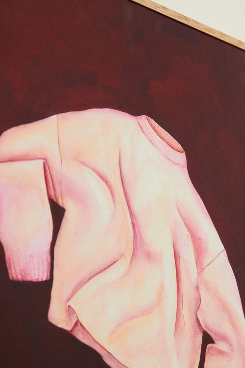 Close-up of a pink garment on a dark background