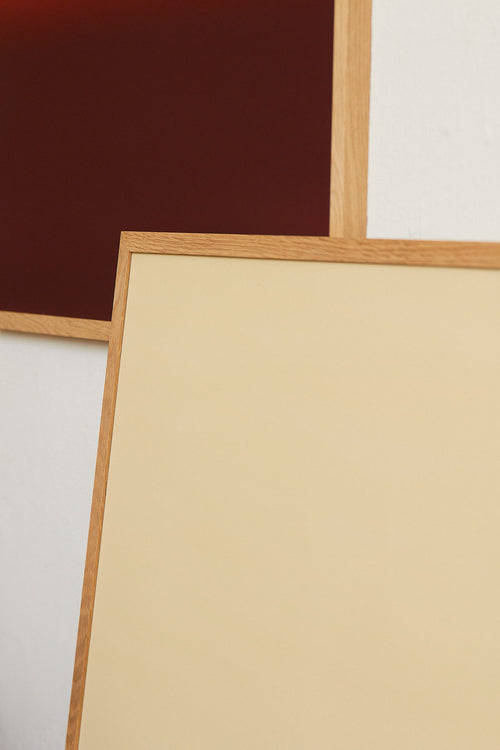 Two wooden picture frames on a white background