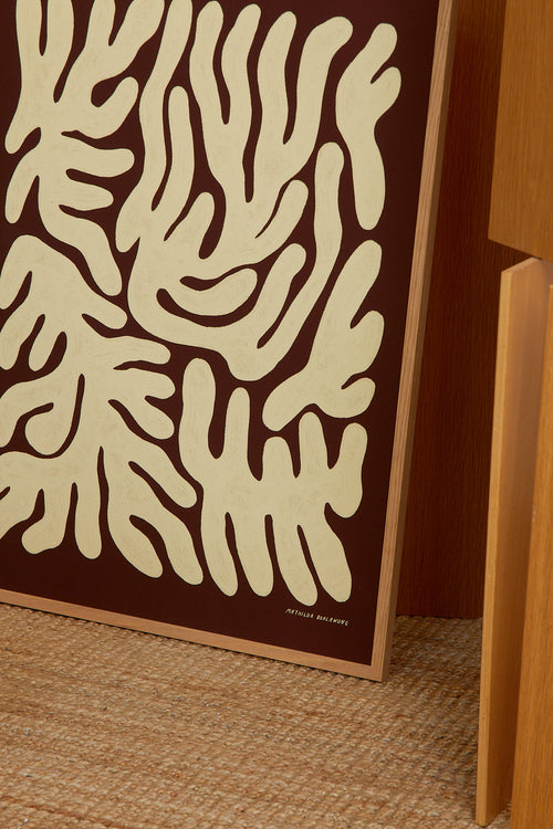 Decorative wall panel with abstract beige design on a brown background
