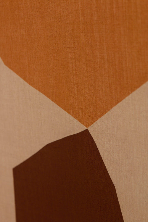 Abstract design with geometric shapes in brown and beige on a textured background