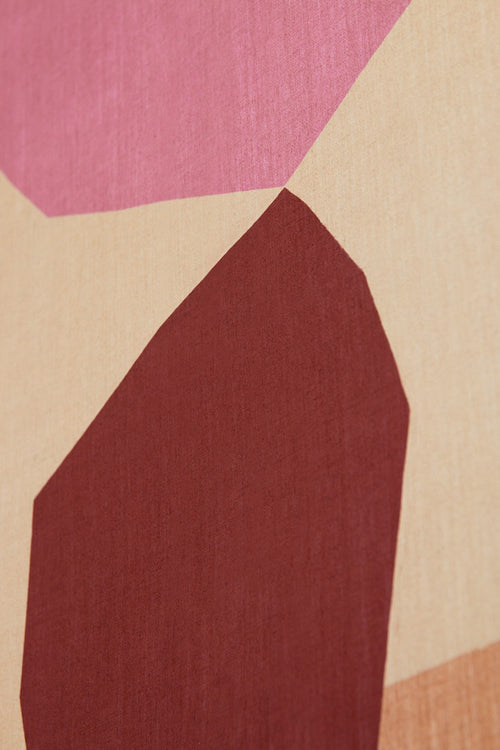 Abstract design with geometric shapes in pink, beige, and brown on a textured background