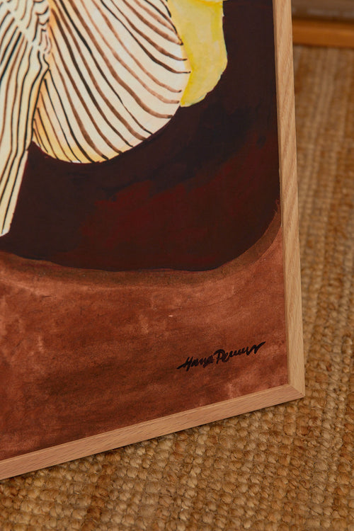 Framed artwork with a signature on a textured surface