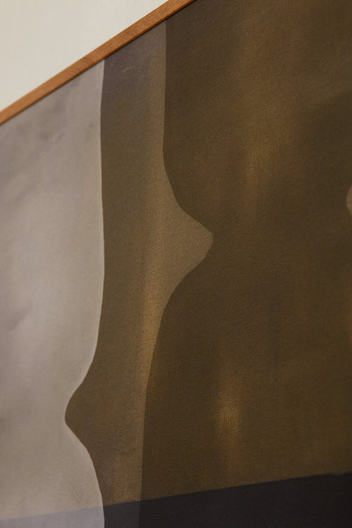 Abstract art with wavy lines in brown and gray on a textured surface