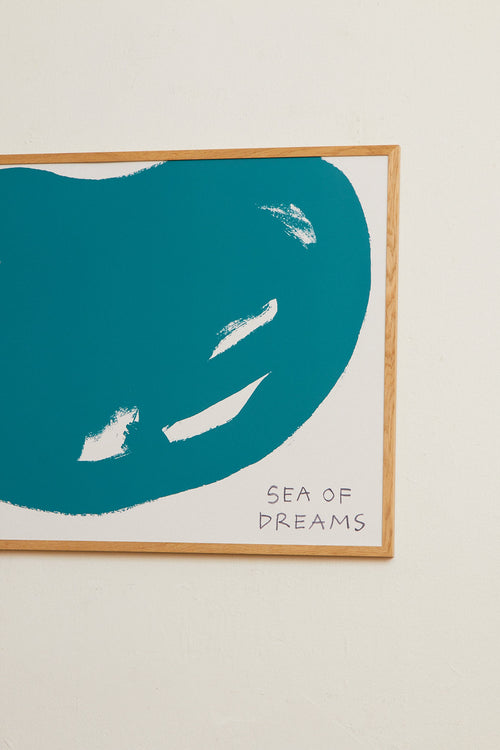 Framed artwork with a blue wave design and 