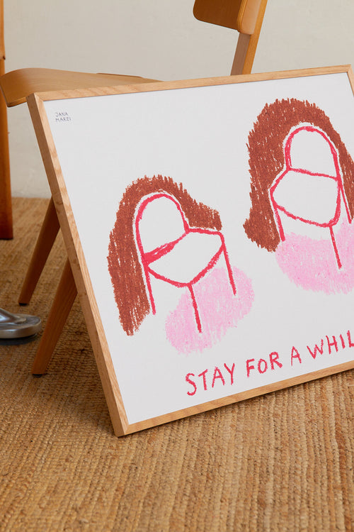 Framed artwork with two abstract faces and 