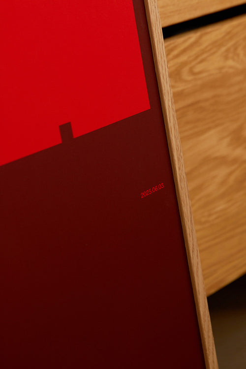 Close-up of a red product with a wooden surface