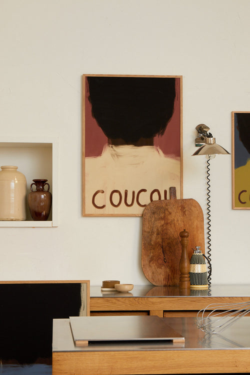 Room interior with a wooden shelf, vases, a lamp, and a framed picture on the wall.