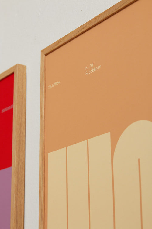 Two framed artworks with abstract designs on a plain background