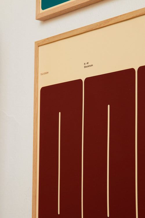 Framed abstract artwork with geometric design on a beige background