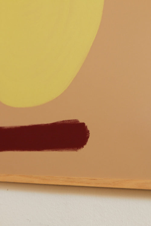 Abstract art with a yellow circle and brown shapes on a beige background