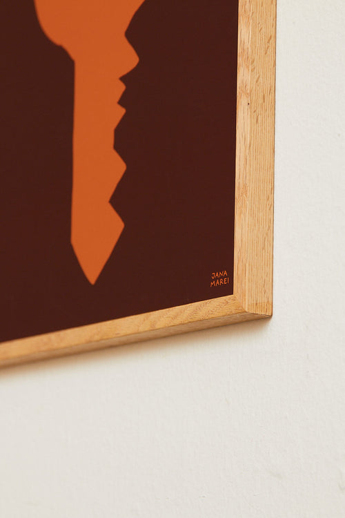 Framed artwork with a silhouette design on a plain background