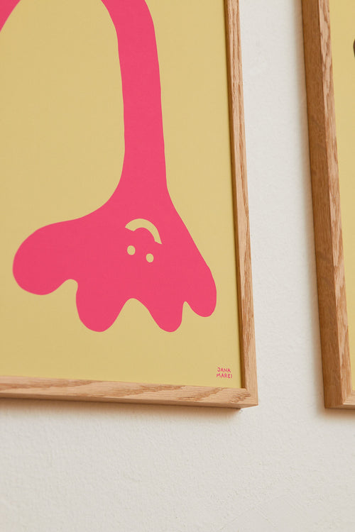 Framed artwork with a pink abstract shape on a yellow background