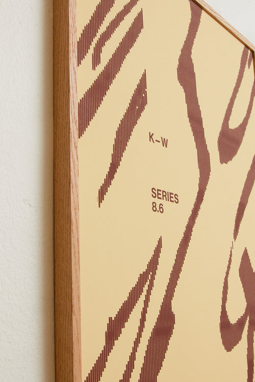 Art print with a graphic illustration of sweeping, organic forms built from dense lines, complemented by small text elements, in brown and beige RAL colors. Styled in a minimalist interior.