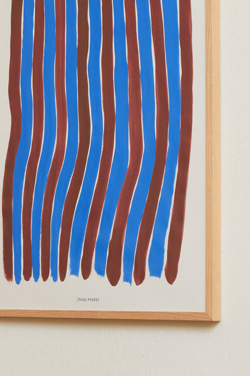 Blue striped art print framed and displayed on a light wall
