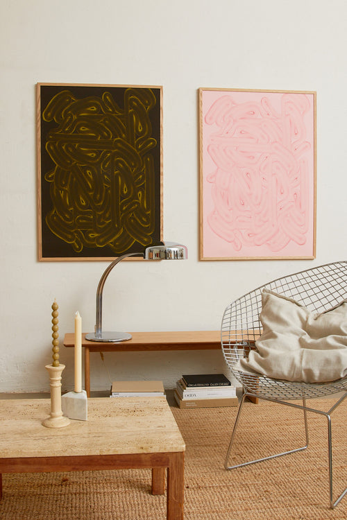 Art print with dense, rounded shapes in two shades of green with yellow accents and a smooth, glossy feel. Styled in a minimalist interior.