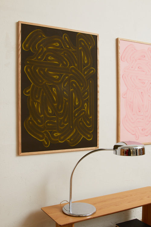 Art print with dense, rounded shapes in two shades of green with yellow accents and a smooth, glossy feel. Styled in a minimalist interior.