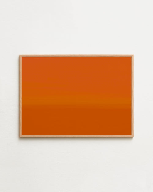Orange abstract painting on a white wall