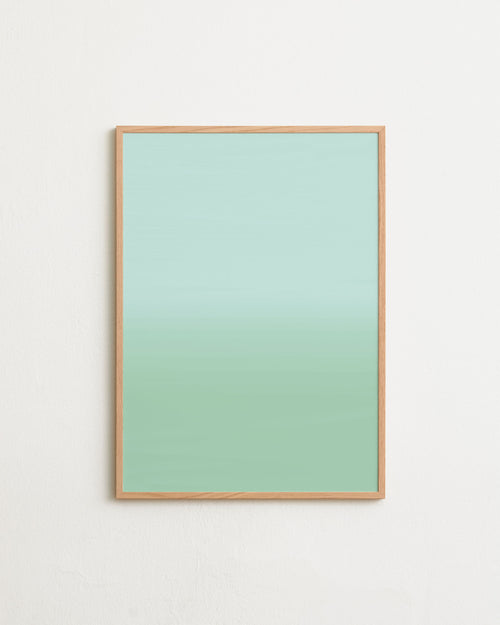 Framed artwork with a gradient green background on a white wall