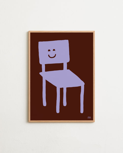 Framed artwork of a purple chair with a smiley face on a brown background