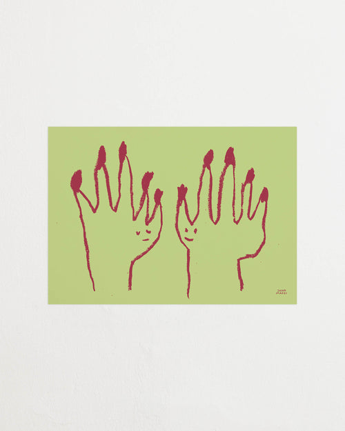 Close-up of the green print showing red line drawing details of the hands