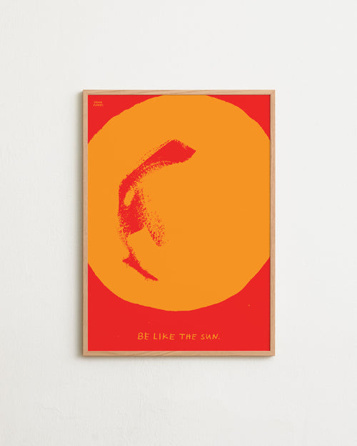 Framed artwork with a yellow circle and fish silhouette on a red background, featuring the text 