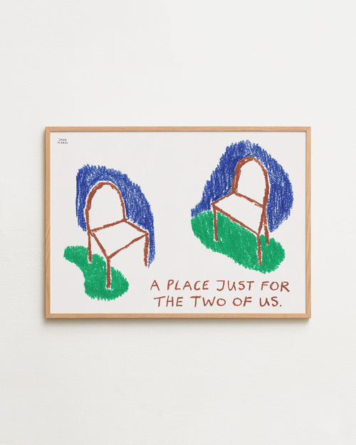 Framed artwork with two chairs and text 