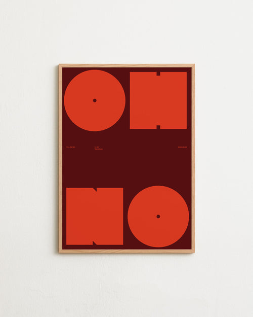 Framed artwork with red geometric shapes on a white background