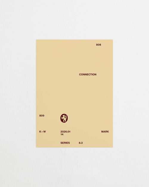 Art print with minimalist, small graphic text elements and a symbol motif in brown against a beige background. Styled in a minimalist interior.
