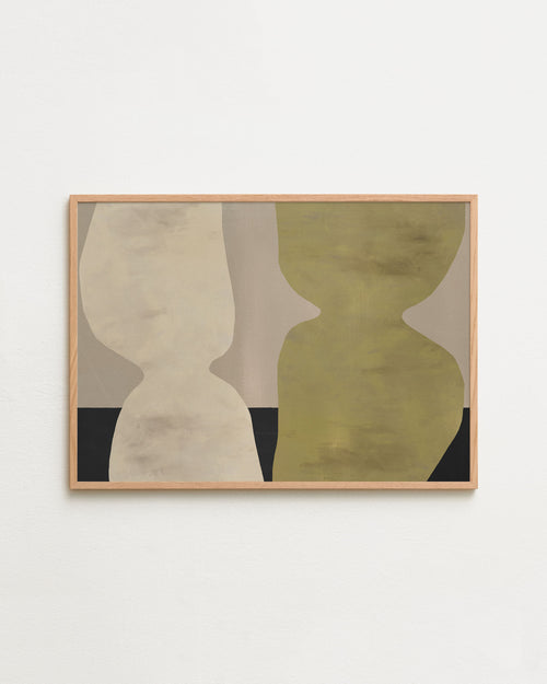 Abstract art piece with geometric shapes in a wooden frame on a white wall