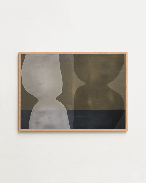 Framed abstract art piece on a white wall