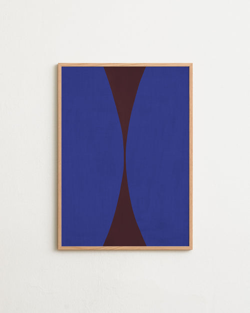 Framed abstract art with blue and brown shapes on a white wall