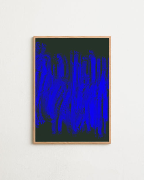 Framed abstract art piece with blue and black design on a white wall