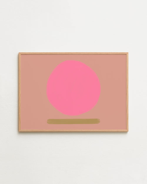 Framed artwork with a pink circle and gold line on a light pink background