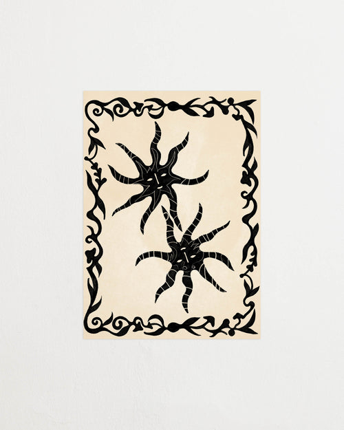 Art print with a minimalist illustration of black, organic, hand-drawn lines and suns against an off-white background. Styled in a minimalist interior.