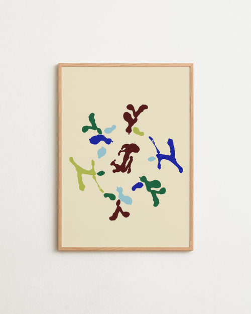 Framed abstract art print with colorful shapes on a beige background